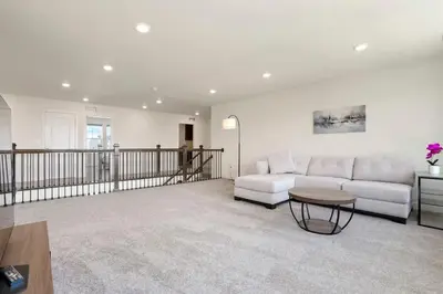 a living room with a white couch and a table at Spacious Luxury Retreat Near Boulder & Denver in Superior