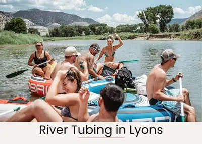 a group of people in kayaks on the water at Cedar Ridge Sanctuary Rocky Mtn Natl Park in Lyons