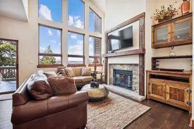 a living room with a couch and a fireplace at Pet-Friendly 4 Bedroom Townhome In Frisco - Short Drive To Breck! in Frisco