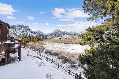 a winter view of the mountains from the deck of a house at Pet-Friendly 4 Bedroom Townhome In Frisco - Short Drive To Breck! in Frisco