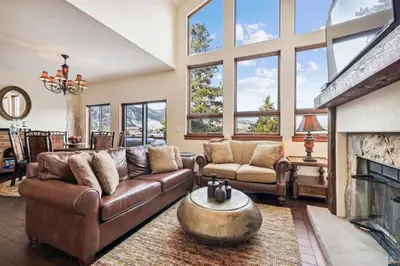 a living room with a couch and a fireplace at Pet-Friendly 4 Bedroom Townhome In Frisco - Short Drive To Breck! in Frisco