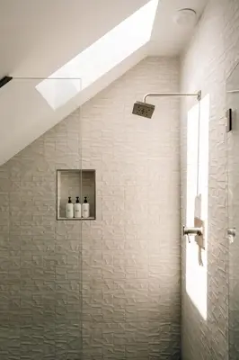 a shower with a glass door in a bathroom at New Modern Luxe Stay - Roof Deck - Center of RiNo in Denver