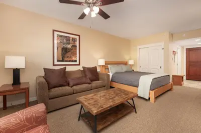 a living room with a bed and a couch at Founders Pointe 4471 Ski In Ski Out Winter Park Resort in Winter Park