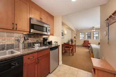 a kitchen with a sink and a microwave at Founders Pointe 4471 Ski In Ski Out Winter Park Resort in Winter Park