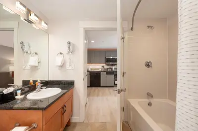 a bathroom with a sink and a tub and a shower at Founders Pointe 4355 Ski In Ski Out Winter Park Resort in Winter Park
