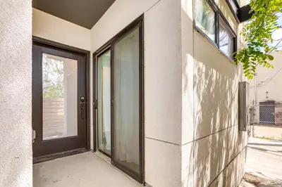 an entrance to a house with a glass door at 2 Mi to Ball Arena Townhome with Rooftop Patio in Denver