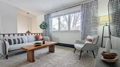 a living room with a couch and a table at Beautiful Monthly 1BR Near NREL & Trails - Quaker Room 3 in Golden