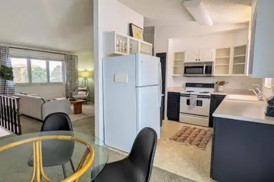 a kitchen and living room with a white refrigerator at Beautiful Monthly 1BR Near NREL & Trails - Quaker Room 3 in Golden