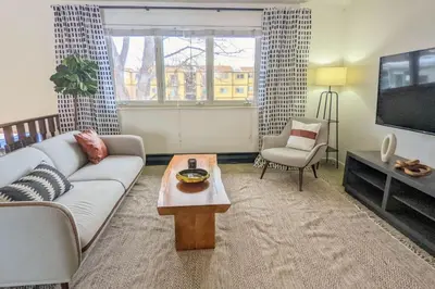 a living room with a couch and a tv at Beautiful Monthly 1BR Near NREL & Trails - Quaker Room 3 in Golden