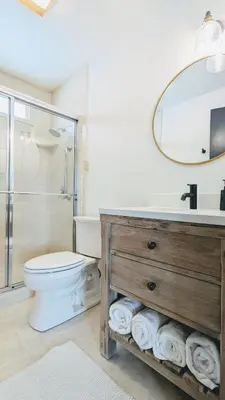 a bathroom with a toilet and a sink and a mirror at Beautiful Monthly 1BR Near NREL & Trails - Quaker Room 3 in Golden