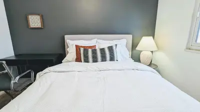 a bedroom with a white bed with a white bedspread at Beautiful Monthly 1BR Near NREL & Trails - Quaker Room 3 in Golden