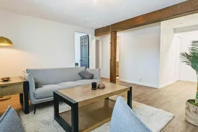a living room with a couch and a table at Beautiful Monthly 1BR Near NREL & Trails - Quaker Room 3 in Golden