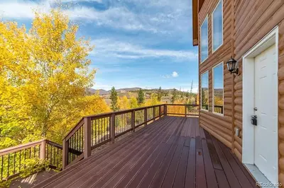 a wooden deck on the side of a house at Mountain Retreat Near Grand Lake in Grand Lake
