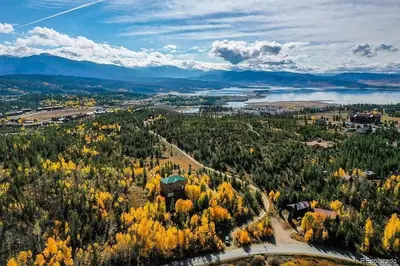 an aerial view of a town with trees and a lake at Mountain Retreat Near Grand Lake in Grand Lake