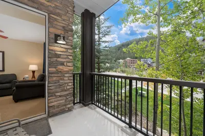 a balcony with a view of the mountains at Fraser Crossing 3227 Ski In Ski Out Winter Park Resort in Winter Park