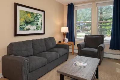 a living room with a couch and two chairs at Fraser Crossing 3227 Ski In Ski Out Winter Park Resort in Winter Park