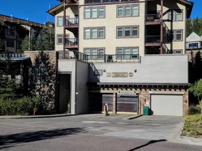 an empty parking lot in front of a building at Fraser Crossing 3423 Ski In Ski Out Winter Park Resort in Winter Park