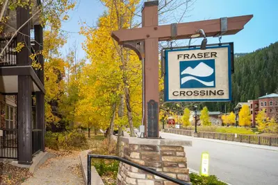 a sign for a creek crossing on a street at Fraser Crossing 3423 Ski In Ski Out Winter Park Resort in Winter Park