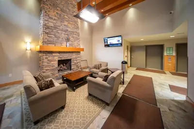 a living room with couches and a fireplace at Fraser Crossing 3423 Ski In Ski Out Winter Park Resort in Winter Park