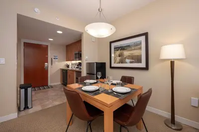 a dining room with a wooden table and chairs at Fraser Crossing 3405 Ski In Ski Out Winter Park Resort in Winter Park