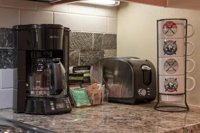 a kitchen counter with a coffee maker and a toaster at Fraser Crossing 3405 Ski In Ski Out Winter Park Resort in Winter Park