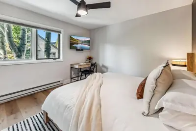 a bedroom with a white bed and a window at 249 E Coyote in Silverthorne