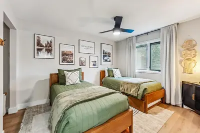 a bedroom with two beds and a ceiling fan at 249 E Coyote in Silverthorne