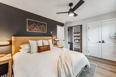 a bedroom with a large bed and a ceiling fan at 249 E Coyote in Silverthorne