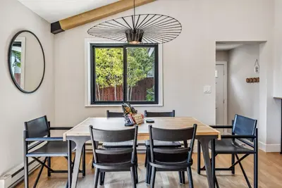 a dining room with a table and chairs at 249 E Coyote in Silverthorne
