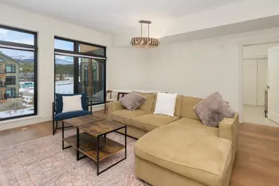 a living room with a couch and a table at Timber Fox 3309 Downtown Condo - Beautiful Fireplace in Winter Park