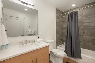 a bathroom with a sink and a toilet and a tub at Timber Fox 3309 Downtown Condo - Beautiful Fireplace in Winter Park