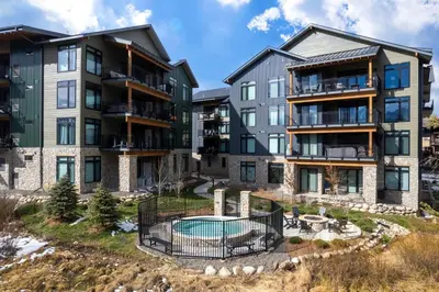 an image of an apartment complex with a pool at Timber Fox 3309 Downtown Condo - Beautiful Fireplace in Winter Park