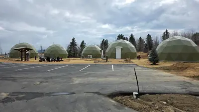 a group of green domes in a parking lot at The Nest at Black Hawk in Black Hawk