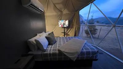 a bedroom with a bed in a tent at The Nest at Black Hawk in Black Hawk
