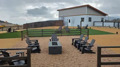 a group of chairs sitting in front of a baseball field at The Nest at Black Hawk in Black Hawk