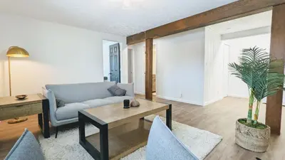 a living room with a couch and a table and chairs at Cozy Monthly 1BR Near NREL & Trails - Quaker Room 1 in Golden