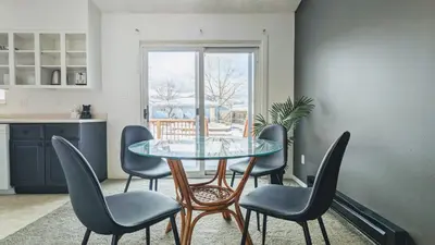 a dining room with a glass table and chairs at Cozy Monthly 1BR Near NREL & Trails - Quaker Room 1 in Golden