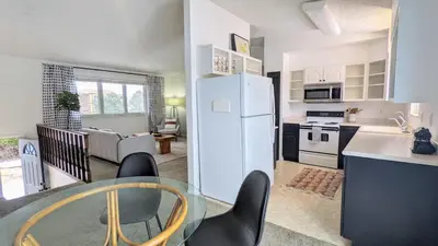 a kitchen and living room with a white refrigerator at Charming 1BR Close to Trails & NREL Monthly Rental - Quaker Room 2 in Golden