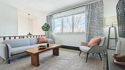 a living room with a couch and a table at Charming 1BR Close to Trails & NREL Monthly Rental - Quaker Room 2 in Golden
