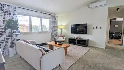 a living room with two couches and a television at Charming 1BR Close to Trails & NREL Monthly Rental - Quaker Room 2 in Golden