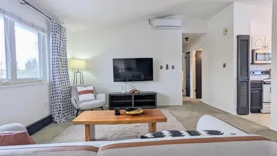 a living room with a couch and a table at Charming 1BR Close to Trails & NREL Monthly Rental - Quaker Room 2 in Golden