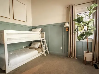 a bedroom with a bunk bed and a potted plant at Midtown Oasis in Fort Collins