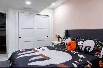 a bedroom with a bed with panda pillows at Midtown Oasis in Fort Collins