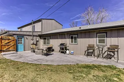 a house with a patio with chairs and a grill at Quiet and Comfy Oasis - Firepit and Yard in Denver in Denver