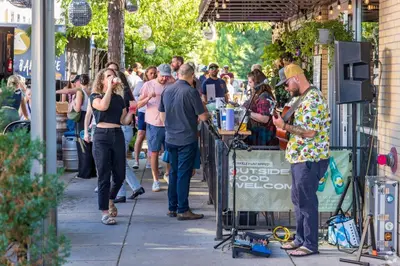 a crowd of people walking down a sidewalk at Quiet and Comfy Oasis - Firepit and Yard in Denver in Denver