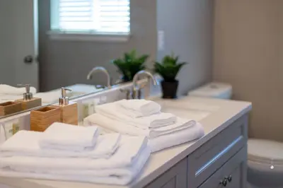 a bathroom with a sink and towels on a counter at Quiet and Comfy Oasis - Firepit and Yard in Denver in Denver