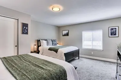 a bedroom with two beds and a window at Spacious and Quiet Retreat - Firepit and Yard in Denver