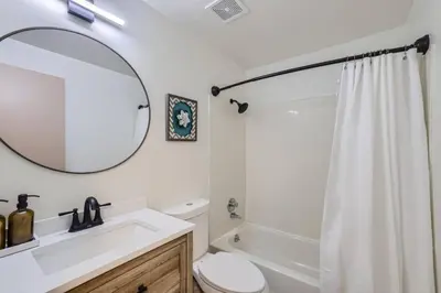 a bathroom with a sink and a toilet and a mirror at Cozy Monthly 1BR near NREL & trails - 7th room 2 in Golden