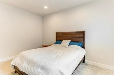 a bedroom with a large bed in a room at 12 Mi to Hospitals Modern Apartment in Aurora! in Aurora