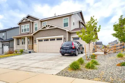 a car parked in front of a house at 12 Mi to Hospitals Modern Apartment in Aurora! in Aurora